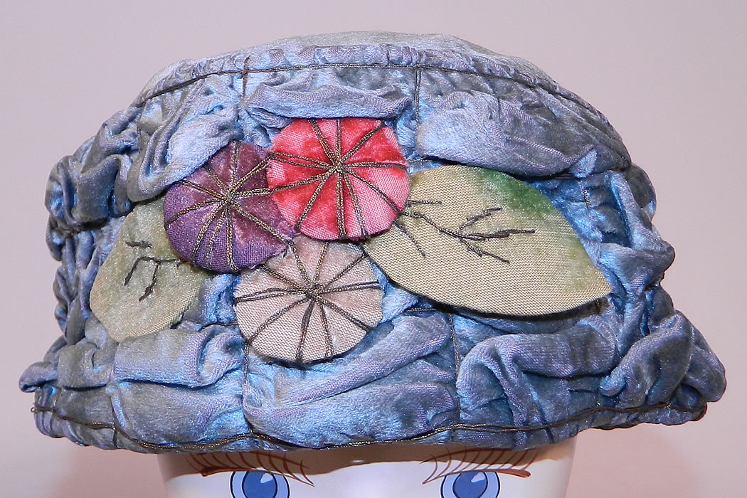 Vintage Ruched Cornflower Blue Gray Velvet Silver Lame Leaf Trim Toque Cloche Hat Lam&eacute;
This vintage ruched cornflower blue gray velvet silver lam&eacute; leaf trim toque cloche hat dates from the 1920s. 
