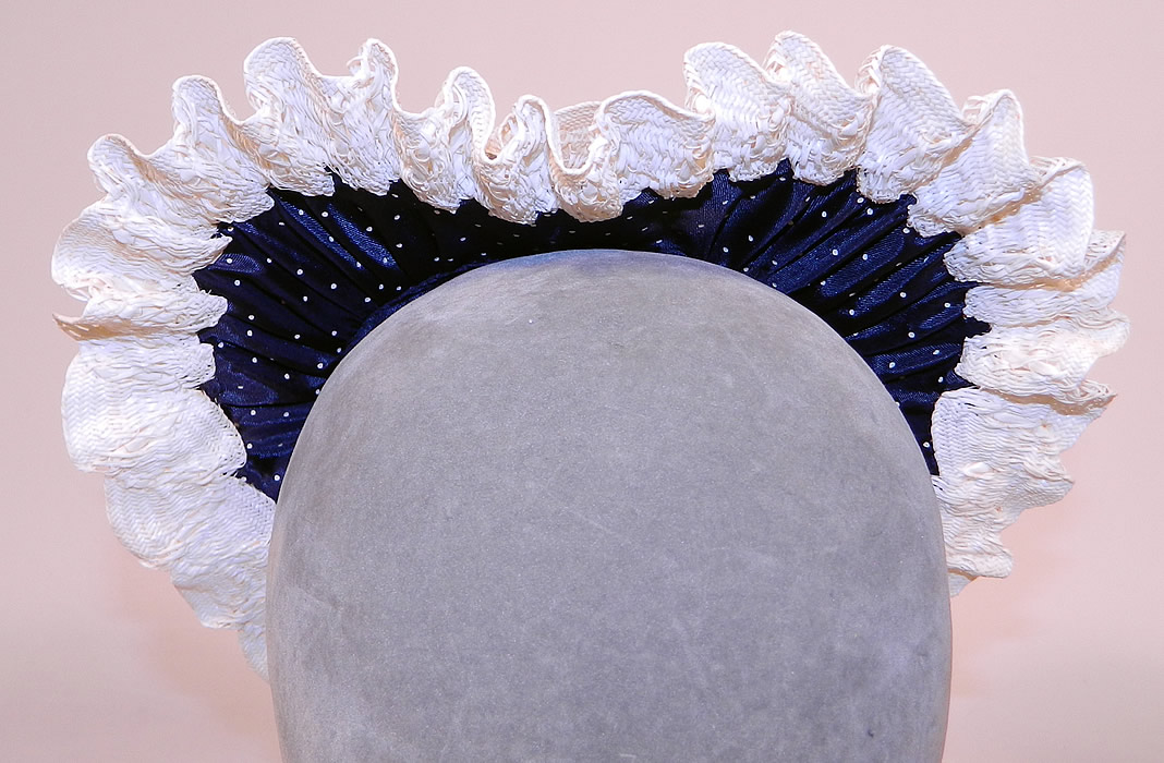 Vintage Navy Blue White Polka Dot Woven Straw Bow Heart Shape Fascinator Hat
This vintage navy blue white polka dot woven straw bow heart shape fascinator hat dates from the 1940s.