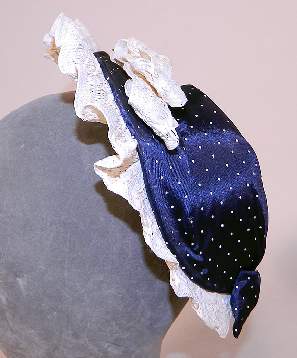 Vintage Navy Blue White Polka Dot Woven Straw Bow Heart Shape Fascinator Hat
It is made of a navy blue and white polka dot fabric, with a white woven straw ruffle trim edging and bow accents on the back top & bottom. 