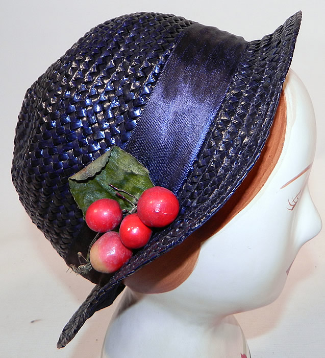 Vintage Navy Blue Woven Straw Red Cherry Silk Ribbon Bow Trim Childs Cloche Hat
This vintage navy blue woven straw red cherry silk ribbon bow trim child's cloche hat dates from the 1920s. 
