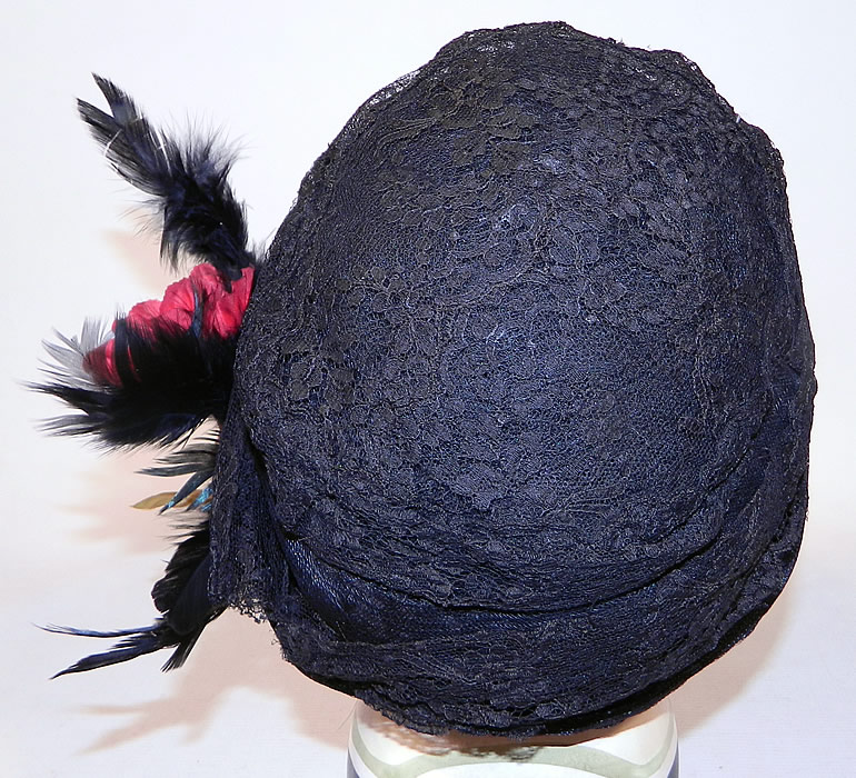 Vintage  Black Woven Straw Silk Lace Red Flower Feather Trim Flapper Cloche Hat
There is a red flower and iridescent black feather trim on the side. 