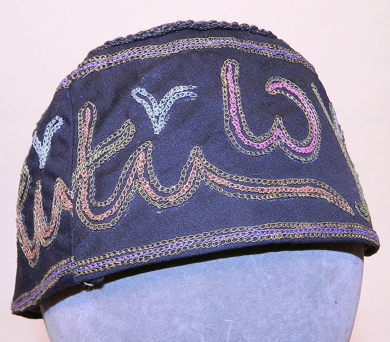 Ottoman Turkish Tugra Smoking Skull Cap Black Silk Gold Embroidered Folk Costume Hat
This vintage Ottoman Turkish Tugra smoking skull cap black silk gold embroidered folk costume hat dates from 1920s. It is made of a black silk fabric, with gold metallic and colorful threads done in tambour chain stitch embroidery work. 