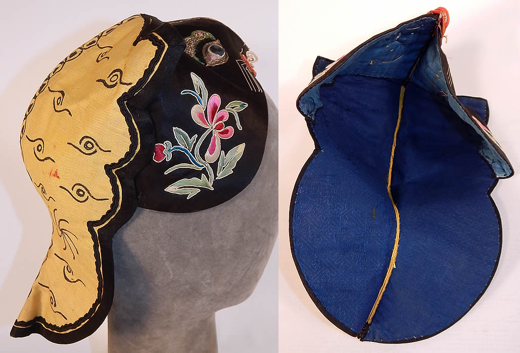 Antique Chinese Child Infant Silk Embroidered Applique Tiger Cat Wind Hat
This charming child's wind hat has a back flap drape covering the back of the neck for warmth and is fully lined, with a blue silk damask weave swastika pattern brocade fabric inside which is the Chinese character for longevity. These Han Chinese children's and infant hats were designed to provide protection from evil spirits, demons, and ghosts, but also to influence the wearing with important qualities such as wealth, health, courage, academic success, happiness, long life, grace and beauty. The hat measures 11 inches long and is 7 inches wide. It is in good condition, with only slight wear, some loose trim and faint stains on the back drape (see close-ups). This is truly a beautiful piece of one of a kind antique Chinese textile art and would make for a wonderful display piece! 