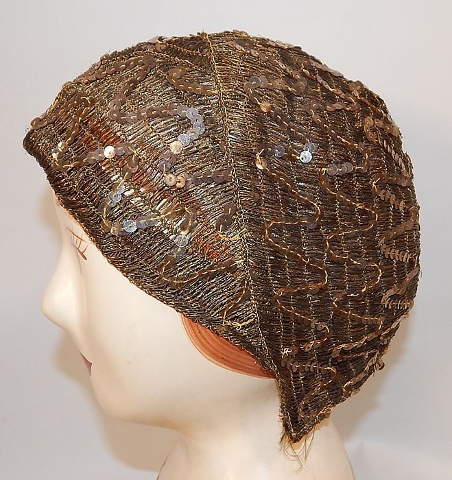 Vintage Smart Hat Label Art Deco Gold Lam&eacute; Lame Woven Sequin Beaded Flapper Cloche
The hat measures 22 inches inside circumference. It is in good condition, with only a few missing sequins and some fraying along the edging. This is truly a wonderful piece of wearable Art Deco millinery art!