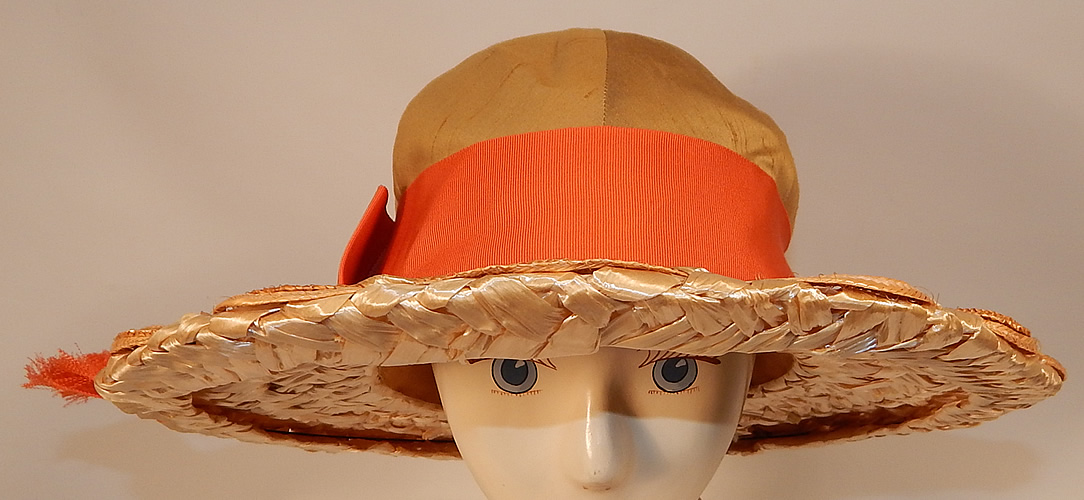 Vintage Schiaparelli Paris Yellow Orange Silk Woven Natural Straw Raffia Wide Brim Hat
It is made of a mustard yellow raw silk fabric crown, with a bright orange silk grosgrain ribbon hatband, bow trim side and woven basket weave natural straw, raffia brim.