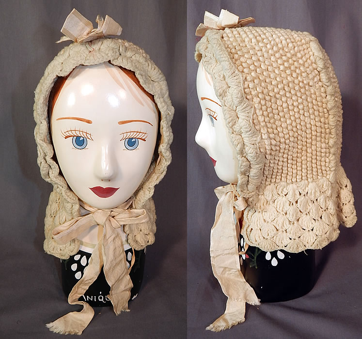 Victorian White Wool Hand Knit Nubby Crochet Winter Sled Carriage Bonnet
This antique Victorian era white wool hand knit nubby crochet winter sled carriage bonnet dates from the 1880s. It is made of an off white cream color hand knit wool yarn, with a nubby knotted texture, crochet bottom edging and ribbon bow trim accents.