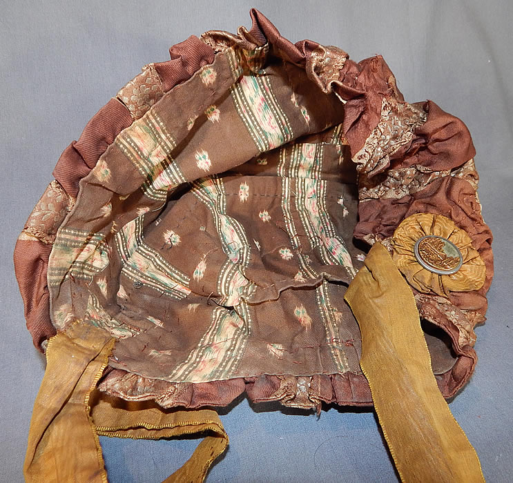 Victorian Brown Silk Ruched Ribbon Steel Cut Button Trim Carriage Bonnet Travel Cap Hat
This beautiful bonnet hood would have been worn for travel in a carriage and has a bonnet bed cap style with muffin top and silk ties for securing under the chin. 