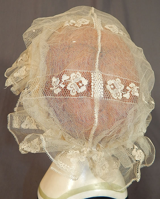 Victorian Civil War Era Antique Cream Net Lace Bed Cap Morning Bonnet Hat
This lovely lace has been created into a boudoir bed cap morning bonnet hat with a muffin top cap style, attached net chin strap and is sheer, unlined. 
