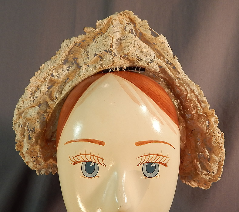 Antique Hand Made Brussels Point de Gaze Duchesse Bobbin Lace Bridal Wedding Hat
The headpiece is made of wire and covered with an off white cream color hand done sheer white filmy linen lace, with veined, raised threads flowers and leaves, joined by braided plaits and has Point de Gaze needle lace petal flower medallions.
