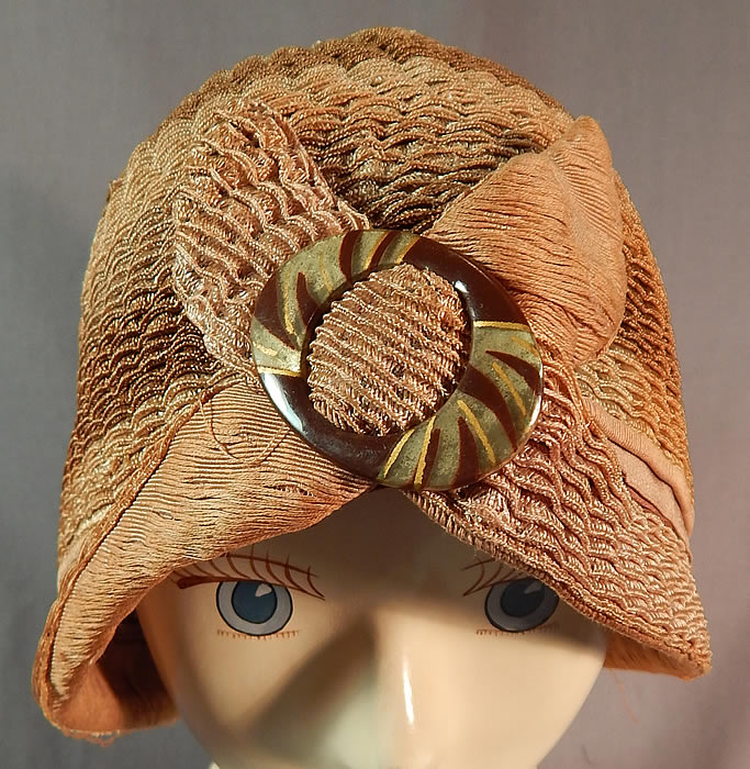 Vintage Art Deco Striped Brown Ombre Woven Straw Flapper Cloche Hat & Buckle
The hat is made of a graduated light to dark shades of brown ombre woven horse hair net straw with a wavy scalloped style. 