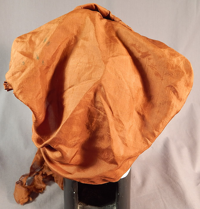 Edwardian Pleated Brown Silk Horseless Carriage Motoring Bonnet Cap Womens Hat
The bonnet has a 13 inch wide front brim. It is in good as-is condition, with some small stains on the back snood and the neck scarf ties have several frayed splits (see close-ups). This is truly a rare and wonderful piece of early motoring wearable millinery art! 
