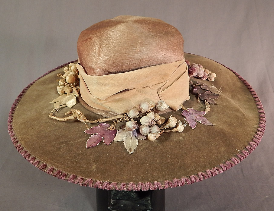 Edwardian Lavender Purple Gray Velvet Grape Berry Leaf Large Wide Brim Hat
This antique Edwardian era lavender purple gray velvet grape berry leaf large wide brim hat dates from 1910.