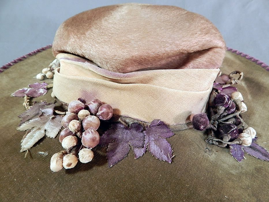 Edwardian Lavender Purple Gray Velvet Grape Berry Leaf Large Wide Brim Hat
It is made of a grayish light purple lavender color velvet fabric, with purple chenille whip stitching trim edging the wired brim. 