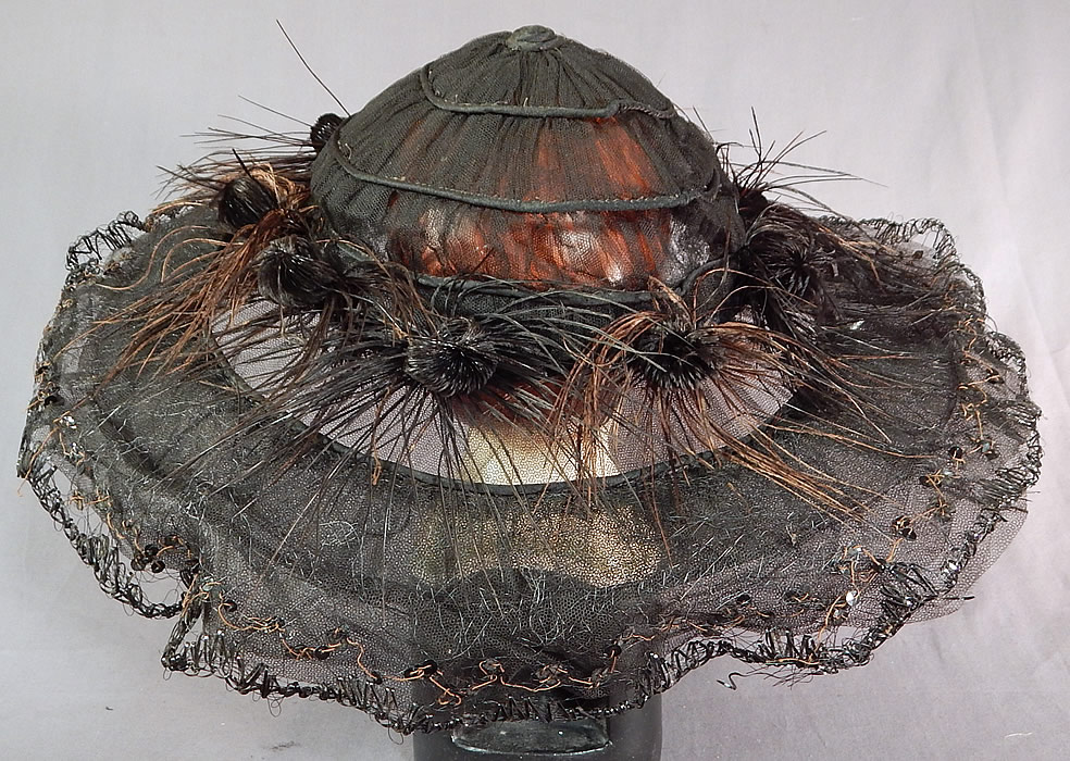 Edwardian Black Tulle Net Sequin Feather Trim Large Wired Wide Brim Hat
This antique Edwardian era black tulle net sequin feather trim large wired wide brim hat dates from 1915.