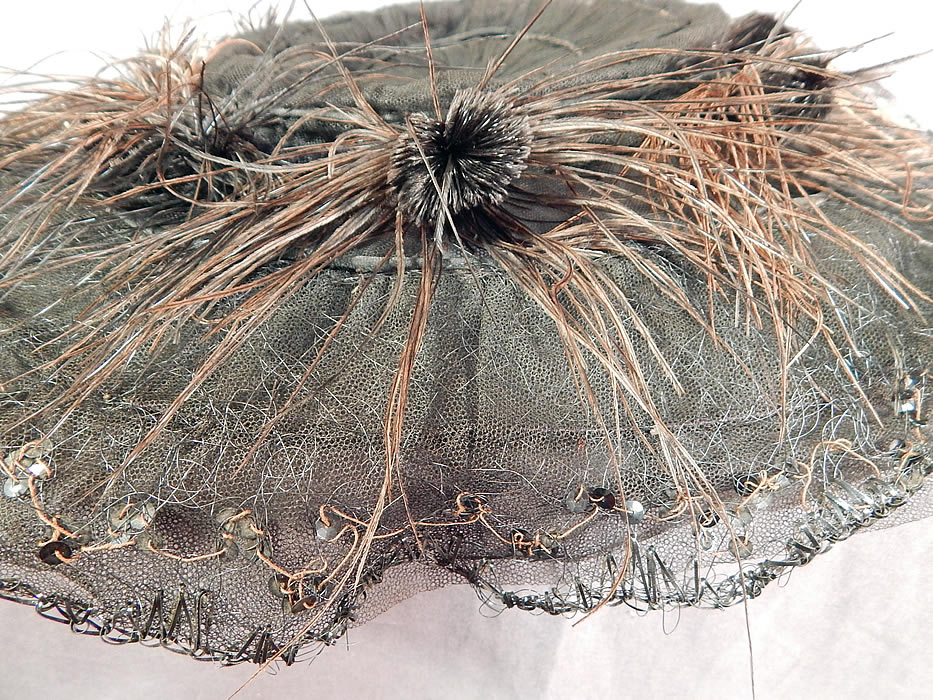 Edwardian Black Tulle Net Sequin Feather Trim Large Wired Wide Brim Hat
It is in good as-is condition, with some fade discoloration on the feathers, some loose feather trim and slight fraying along the brim edging in areas (see close-ups). 