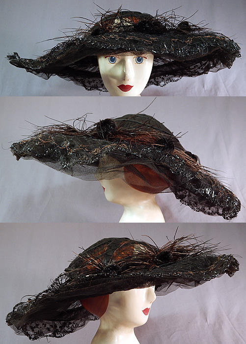 Edwardian Black Tulle Net Sequin Feather Trim Large Wired Wide Brim Hat
There are black feather pom pom trim accents surrounding the crown and black sequins stitched around the layered scalloped ruffle edge brim. 
