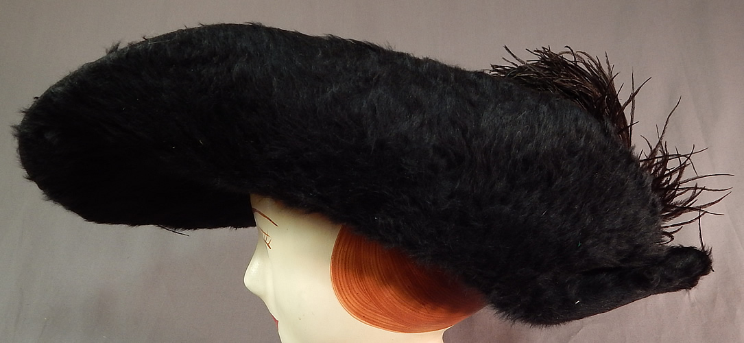 Edwardian Titanic Black Beaver Felt Fur Feather Large Wide Upturned Brim Tricorn Hat
This fabulous furry grand hat has a wide brim upturned along the sides creating a tricorn style and a large oversized round crown. 