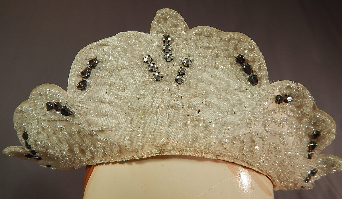 Vintage Rhinestone Beaded Tiara Crown Bridal Wedding Headpiece Juliet Cap
It is made of a white stiffened silk covered mesh net fabric scalloped edge tiara crown headpiece with crystal beading and prong set rhinestones hand sewn covering the front.
