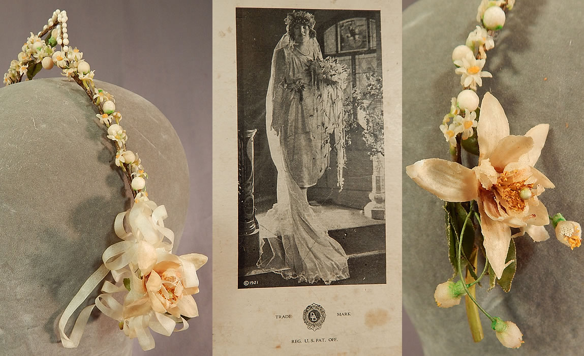 Vintage French Flapper Wax Flower Bridal Wreath Wedding Headband Headpiece & Box
The tiara headpiece is made of an off white cream color wax orange blossom flowers, pearl droplets, silk ribbon, flowers attached to a wrapped wired base headband. 