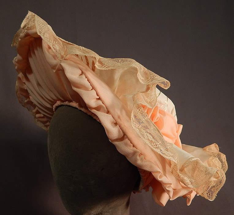 Victorian Style Ruth Stockley Society Silk Embroidery Floral Peach Bonnet Hat
The hat is hand made by the late milliner Ruth Stockley in the 1980s, she was the foremost authority on the design and construction of 20th century millinery. 