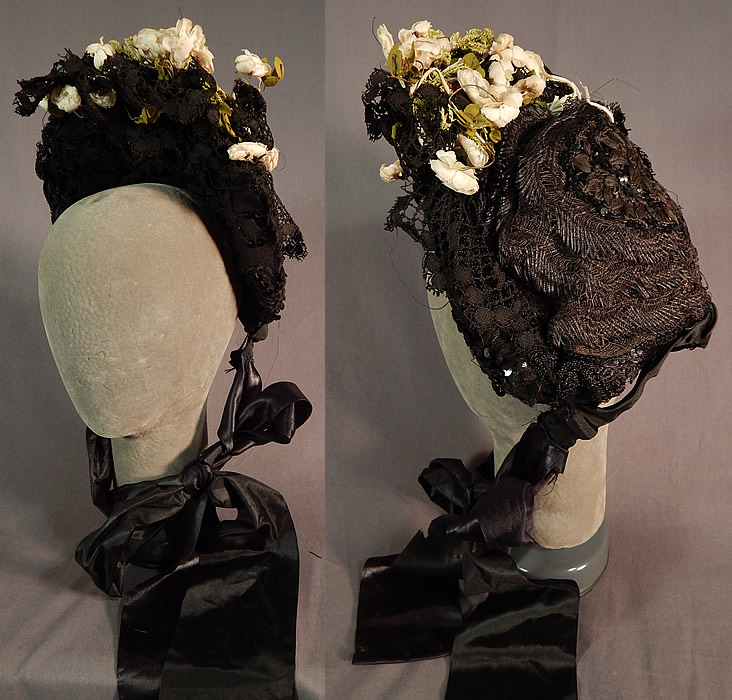 Victorian Woven Black Straw Lace Sequin White Flower Trim Bonnet Hat
This antique Victorian era woven black straw, lace, sequin, white flower trim bonnet hat dates from the 1880s. It is made of a black tulle net fabric, with black woven straw, sequin beading, black lace trim and white silk flower trimming the top.