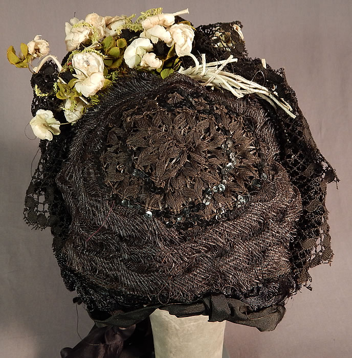 Victorian Woven Black Straw Lace Sequin White Flower Trim Bonnet Hat
It is in good condition, with a few loose missing sequins and some slight fraying on the silk ribbon ties. This is truly a wonderful piece of wearable antique mourning Victoriana millinery art.