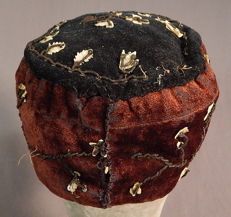 Victorian Gold Bullion Embroidered Brown Velvet Gentlemens Smoking Cap
It is in fair as-is condition, with some minor wear to the velvet nap in areas, mostly around the bottom edging and there are some loose, missing gold bullion embroidery stitching, white shape cut out appliques (see close-ups). This is truly a rare and wonderful piece of men's Victoriana wearable art! 