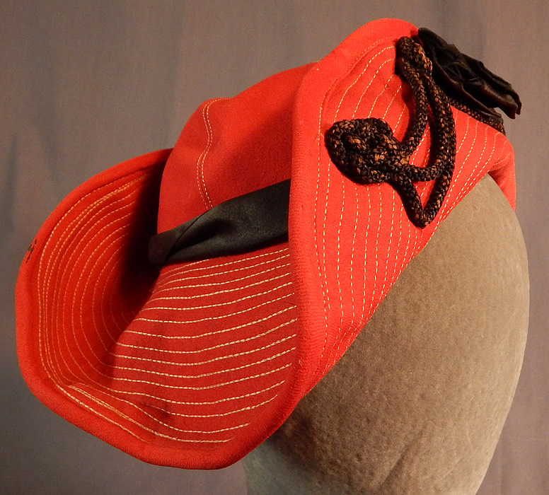 Vintage Victor Girls Red Wool White Stitched Black Bow Trim Bicorn Breton Hat
This unique Blossom style Breton bicorn girls child's hat has a round crown, upturned rolled brim on the front and back exposing the face. 