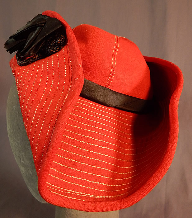 Vintage Victor Girls Red Wool White Stitched Black Bow Trim Bicorn Breton Hat
It is in good condition, with only some slight wear along the rope trim. 