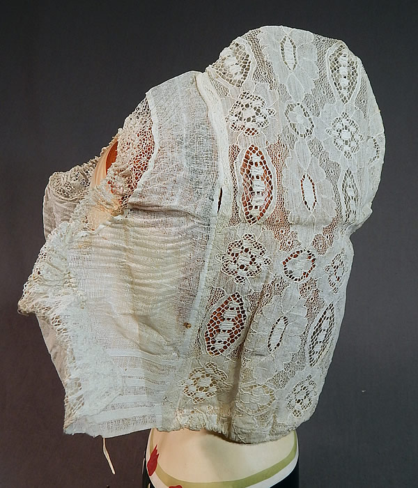 Vintage Antique Womens White Lace Dutch Folk Costume Bonnet Cap Hat
The beautiful bonnet measures 11 inches tall, 12 inches in circumference around the bottom with an additional 6 inch tie strap on each side and is 6 inches wide deep, 12 inches wide from the front flaps to the back. 