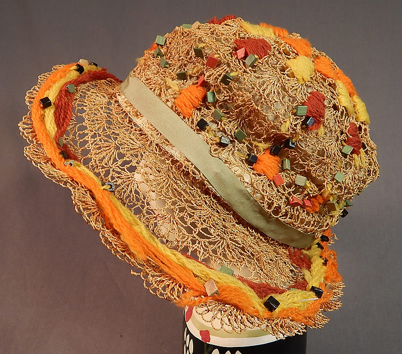 Vintage Woven Natural Straw Colorful Wood Beaded Embroidered Yarn Wide Brim Cloche Hat
This vintage woven natural straw colorful wood beaded embroidered yarn wide brim hat dates from the 1920s.