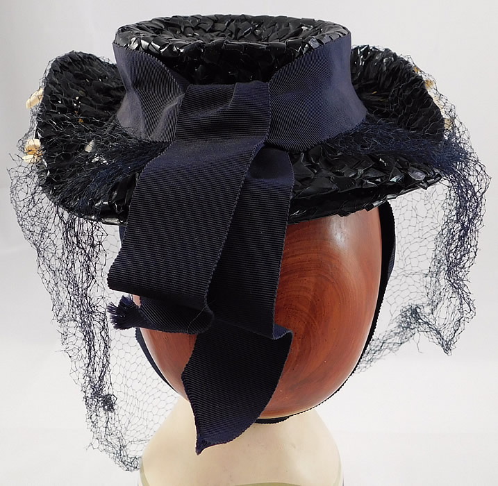 Vintage Taylor's Raleigh Flowering Dogwood Navy Blue Straw Veiled Fascinator Hat
It is in good condition with only a few small frayed holes in the net veil. This is truly a wonderful piece of wearable millinery art! 