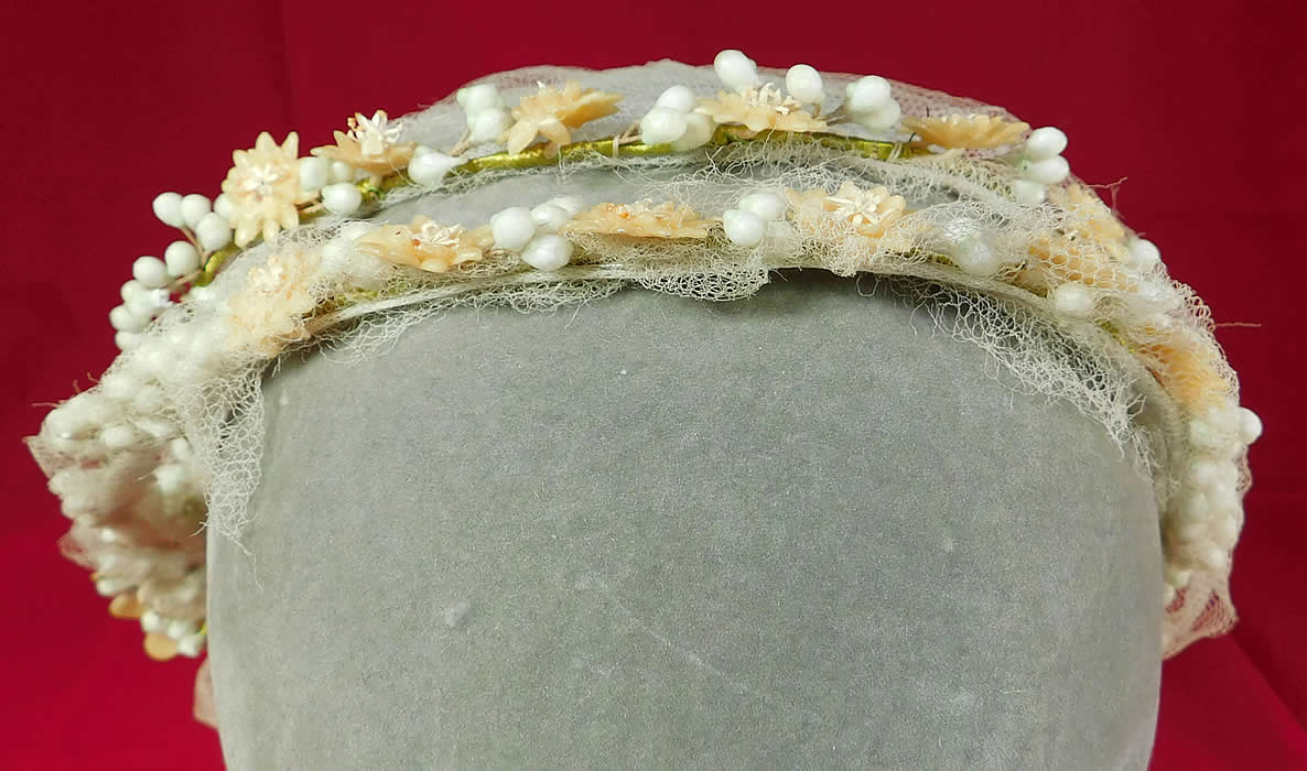 Vintage Wax Flower Bridal Wreath Wedding Headband Headpiece Juliet Cap	
The headpiece is made of a white wax orange blossom flowers and pearl droplets attached to a green wrapped wired base headband.