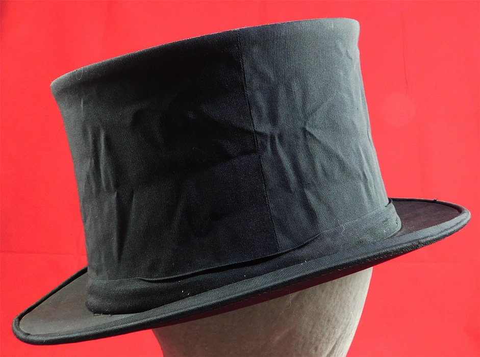 Vintage Finchley Establishment Fifth Ave NY Men's Black Silk Collapsible Opera Top Hat
This dashing dapper gentleman's opera "topper" top hat is collapsible, which is stored flat and pops up to be worn.