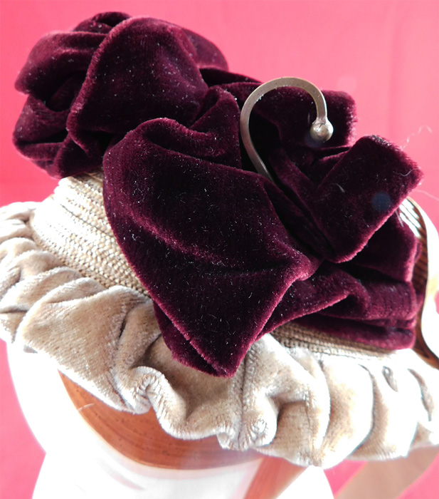 Victorian Woven Natural Straw Beige Burgundy Velvet Brass Hook Trim Bonnet Hat
The bonnet measures 16 inches around the front opening, 8 inches tall and 4 inches deep. It is in good condition, with only some fraying of the white silk lining inside.