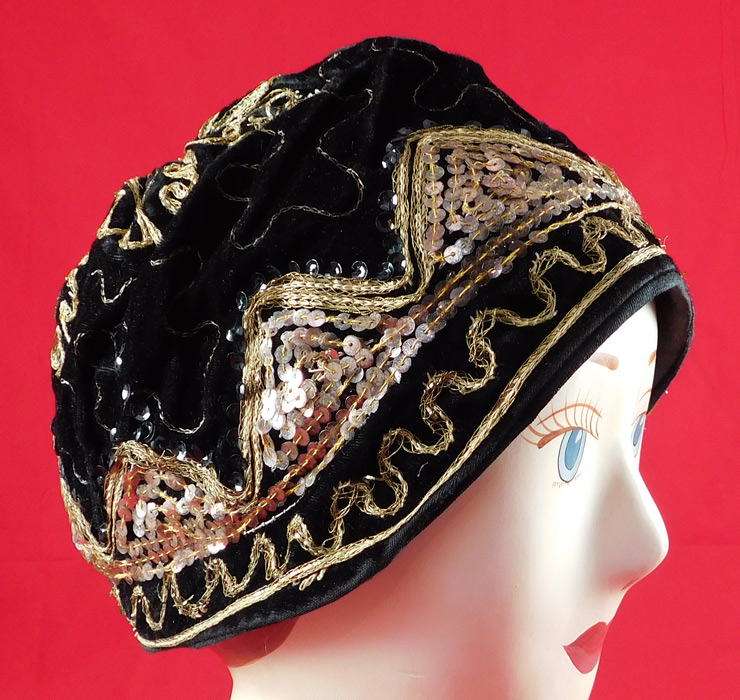 Vintage Wistaria Art Deco Black Velvet Gold Sequin Embroidered Flapper Cloche Hat
This vintage Wistaria Art Deco black velvet gold sequin embroidered flapper cloche hat dates from the 1920s. 