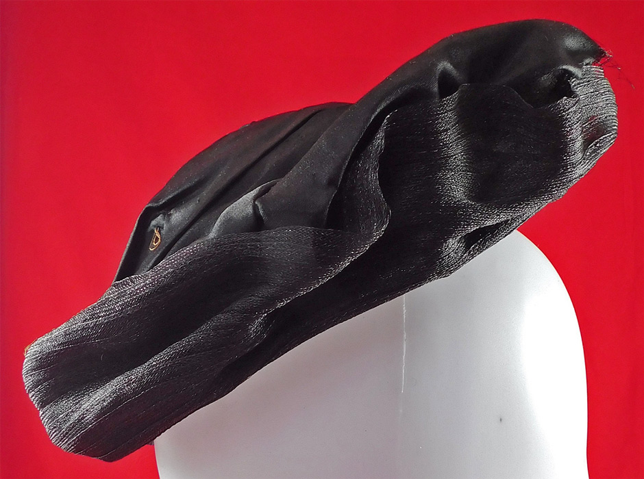Victorian Black Crinoline Woven Horse Hair Silk Jet Beaded Trim Bonnet Hat
This beautiful black bonnet has a circular covered wired frame with a stand up wide brim along the top framing the face, decorative button trim on the back and is fully lined with a black silk fabric inside. 