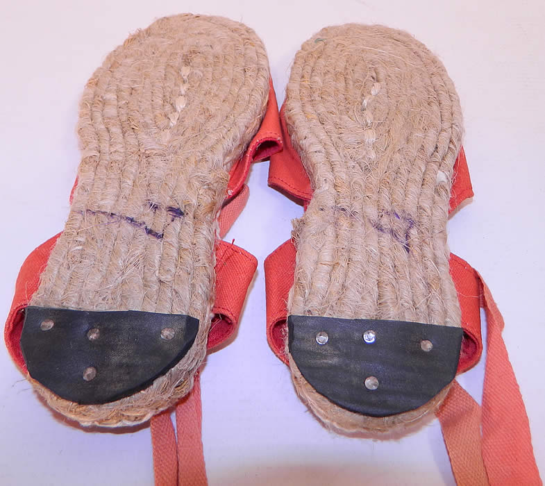 Vintage Red Linen Goldfish Ankle Tie Rope Sole Childrens Beach Sandal Shoes. The shoes measure 7 1/2 inches long, 3 inches wide and are stamped on the bottom soles a size 7.
