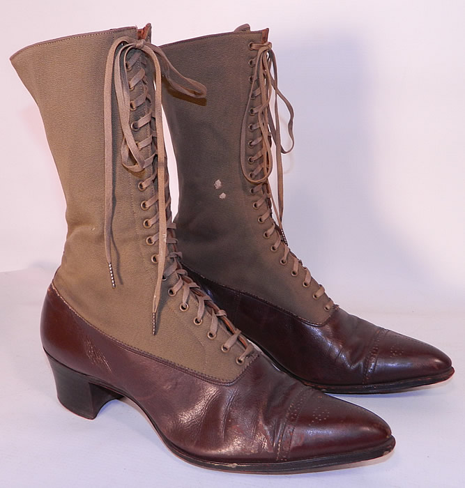 Victorian Brown Wool & Leather Two Tone High Top Lace-up Boots. The boots have the original tan shoe laces, pointed toes with decorative punch work designs, a leather trim strip on the back and stacked wooden cube heels.