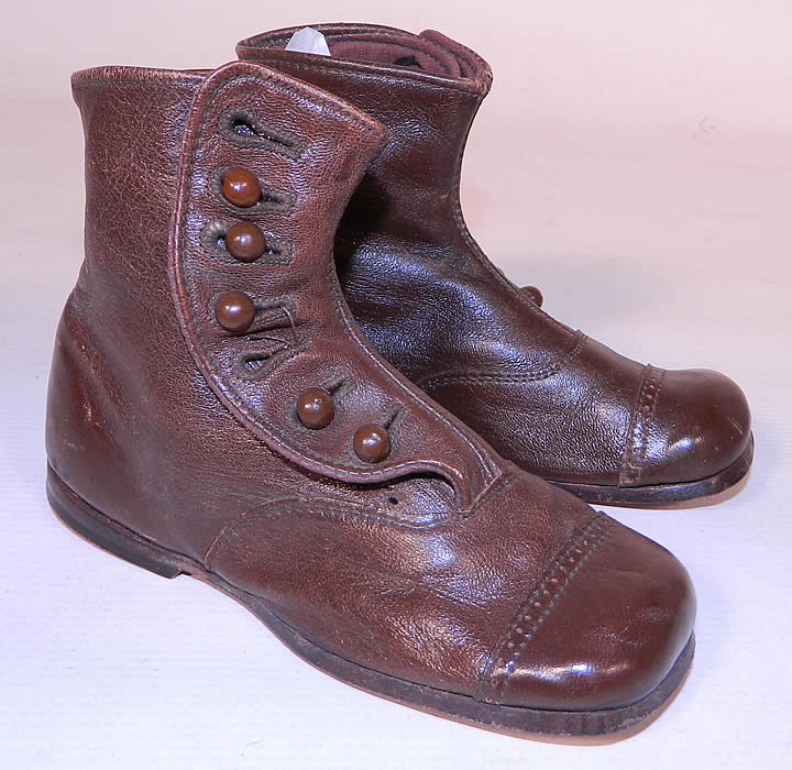 Victorian Antique Brown & Skylark Leather High Button Baby Boots Childs Shoes. These precious little shoes have 7 brown buttons along the sides for closure, rounded square toes with decorative punch work, hard leather bottom soles with a low stacked heel and stamped on the bottoms "Brown & Skylark". 