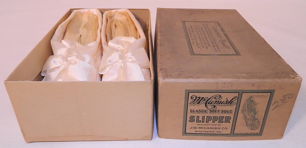 Vintage McCamish Funeral Burial White Satin Slipper Shoes. They have elastic bands which can conform to any width foot and are lined in a quilted white satin with white satin bottom soft soles. 