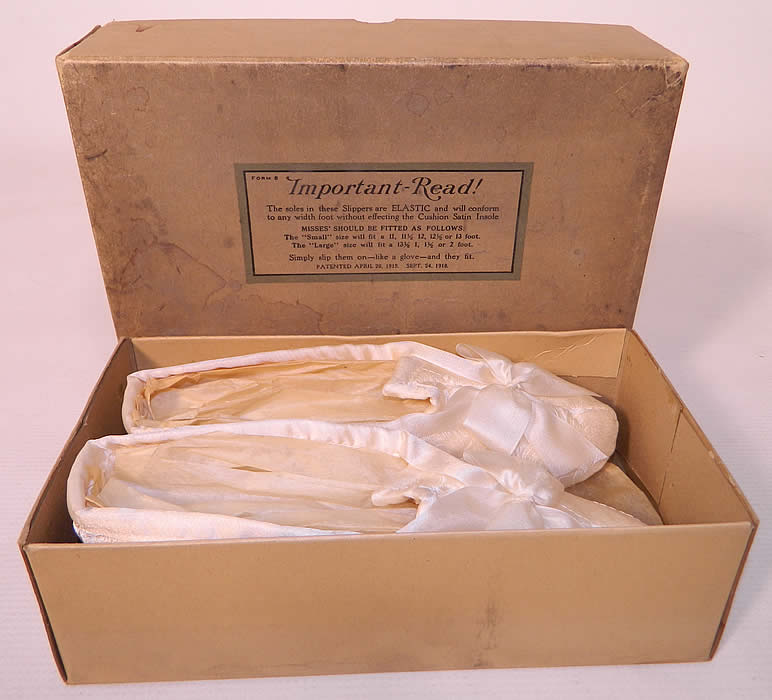 Vintage McCamish Funeral Burial White Satin Slipper Shoes. They are in excellent condition, with only some small water spotting stains on the cardboard box. These are a rare find which would make for a great mourning display! 