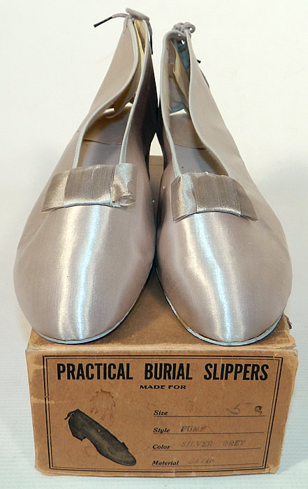 Vintage Practical Burial Slippers Silver Grey Satin Funeral Shoes Pumps. These beautiful burial funeral shoes have adjustable shoe strings laces on the back, a pump style with faux heels and cardboard bottom soles.