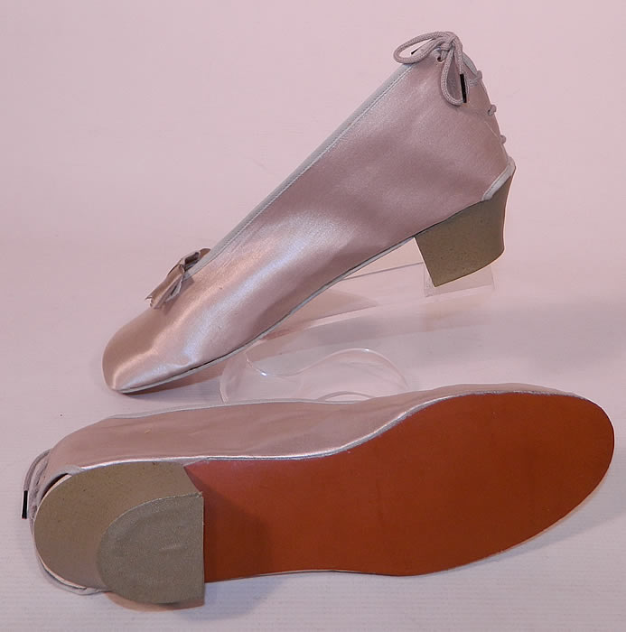 Vintage Practical Burial Slippers Silver Grey Satin Funeral Shoes Pumps. This unique pair of unworn in the box, burial slippers measure 11 inches long, 3 inches wide, with a 2 inch heel. They are in excellent condition, with only some small water spotting stains and wear on the cardboard box.
