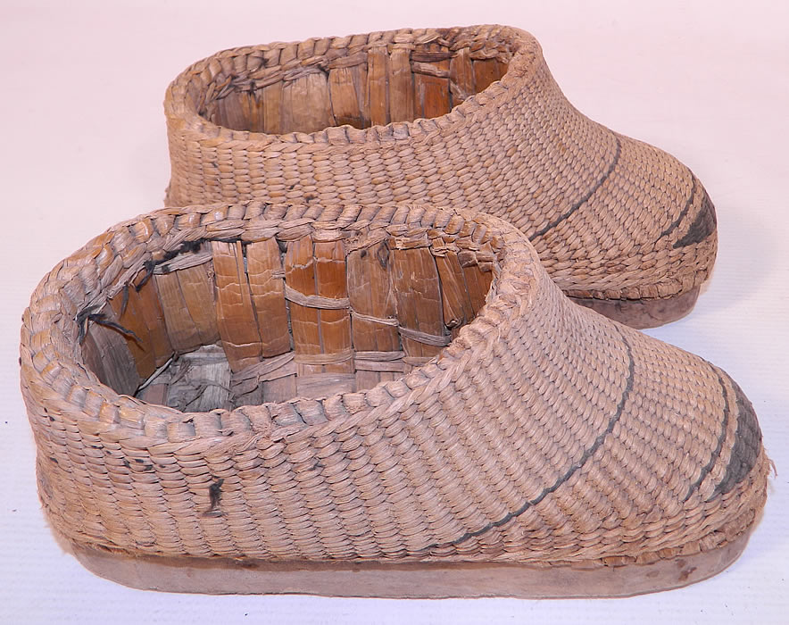 Antique Chinese Woven Braided Straw Hand Carved Wooden Farmers Shoes. These unique women's workers farm shoes have a wooden sole platform lift and a woven reed lining inside.