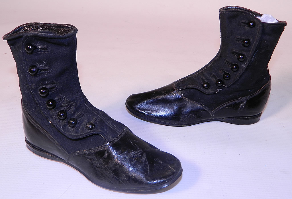 Victorian Black Wool Leather High Button Button Baby Boots Childs Shoes. This pair of antique Victorian era black wool and leather high button baby boots child's shoes date from 1890. 