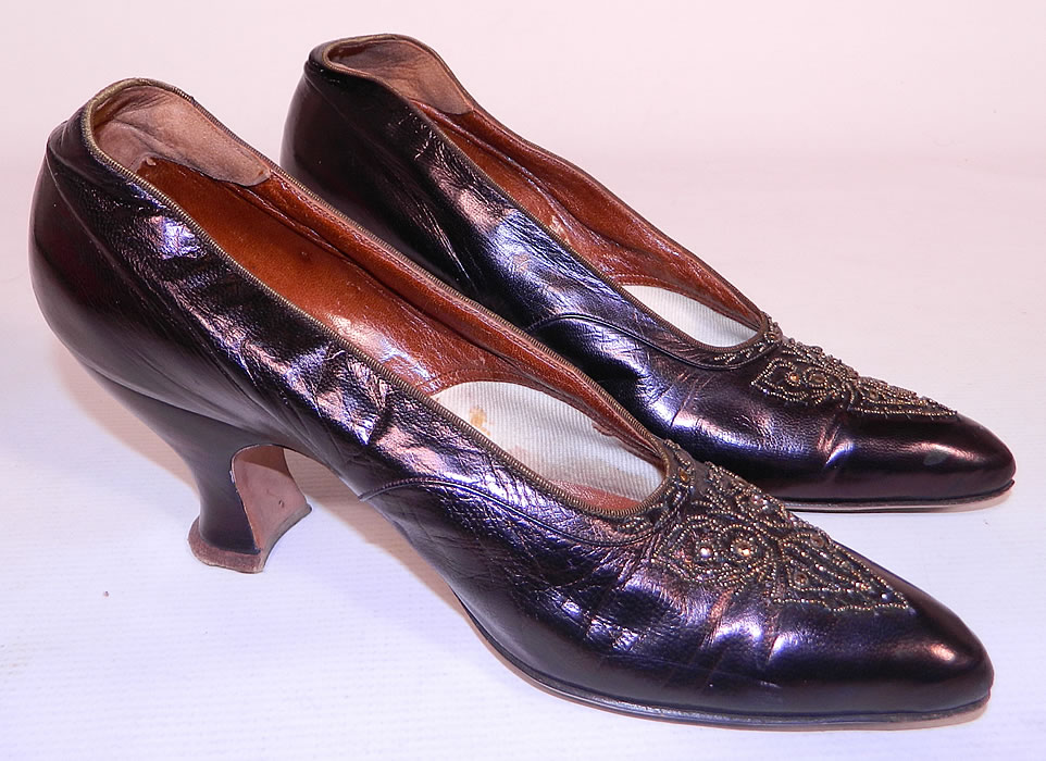 Vintage G. Fox & Co.  Edwardian Titanic Era Iridescent Aubergine Bronze Beaded Shoes. These elegant evening shoes have a slip on slipper style, with pointed toes and French Louis XV spool heels. 