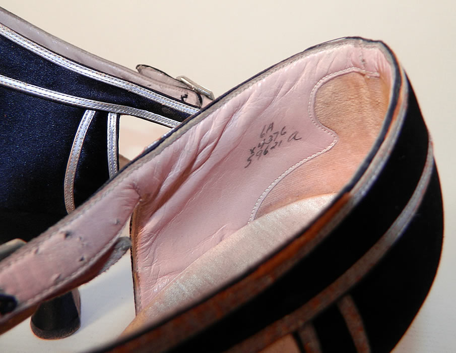 Vintage Saks Fifth Avenue Art Deco Silver Lam&eacute; Black Satin T-Strap Shoes. They have been gently worn and are in good condition, with only some wear along the silver leather trim. These are truly a wonderful piece of Art Deco textile art! 