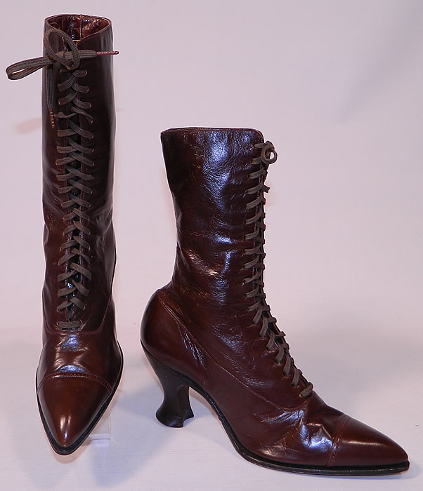 Unworn Victorian Walk Over Brown Leather High Top Lace-up Boots. The boots have the original brown shoe laces, pointed toes and wooden French spool heels. 