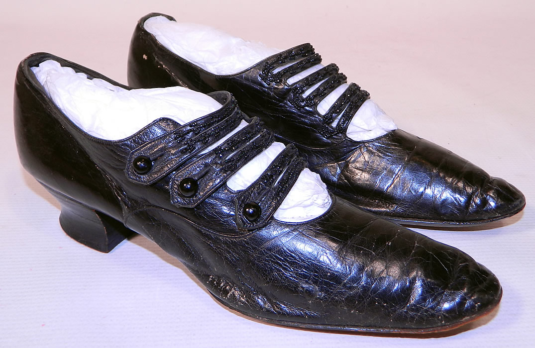 Victorian Black Leather Jet Beaded Button Strap Mary Jane Shoes. This pair of antique Victorian era black leather jet beaded button strap Mary Jane shoes date from 1900. They are made of black leather, with black jet beaded straps.